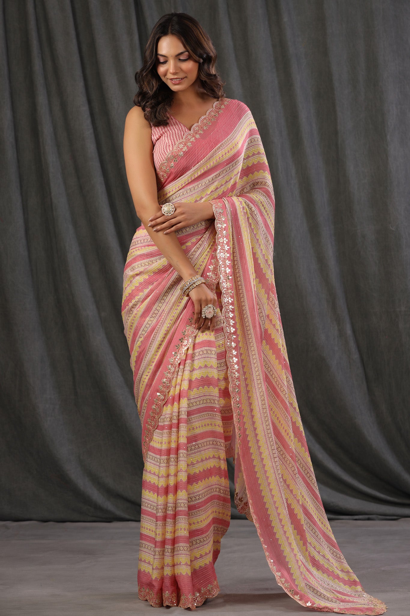 Buy light pink and yellow crepe saree online in USA with embroidered border and blouse. Make a fashion statement at weddings with stunning designer sarees, embroidered sarees with blouse, wedding sarees, handloom sarees from Pure Elegance Indian fashion store in USA.-front