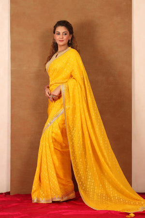 Buy yellow embroidered Banarasi Khaddi saree online in USA with blouse. Make a fashion statement at weddings with stunning designer sarees, embroidered sarees with blouse, wedding sarees, handloom sarees from Pure Elegance Indian fashion store in USA.-pallu