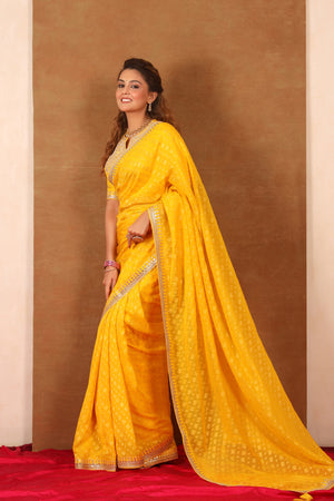 Buy yellow embroidered Banarasi Khaddi saree online in USA with blouse. Make a fashion statement at weddings with stunning designer sarees, embroidered sarees with blouse, wedding sarees, handloom sarees from Pure Elegance Indian fashion store in USA.-side