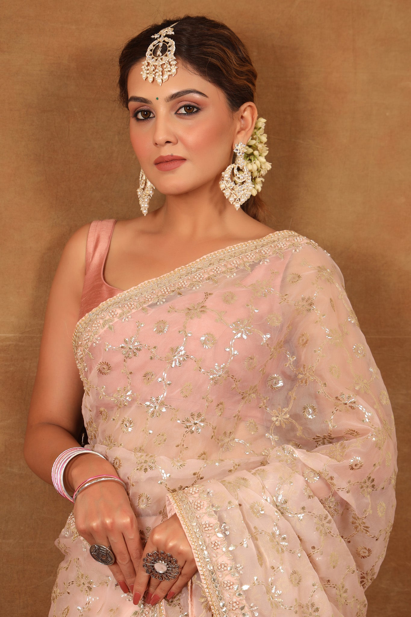 Buy powder pink embroidered organza silk saree online in USA with blouse. Make a fashion statement at weddings with stunning designer sarees, embroidered sarees with blouse, wedding sarees, handloom sarees from Pure Elegance Indian fashion store in USA.-closeup