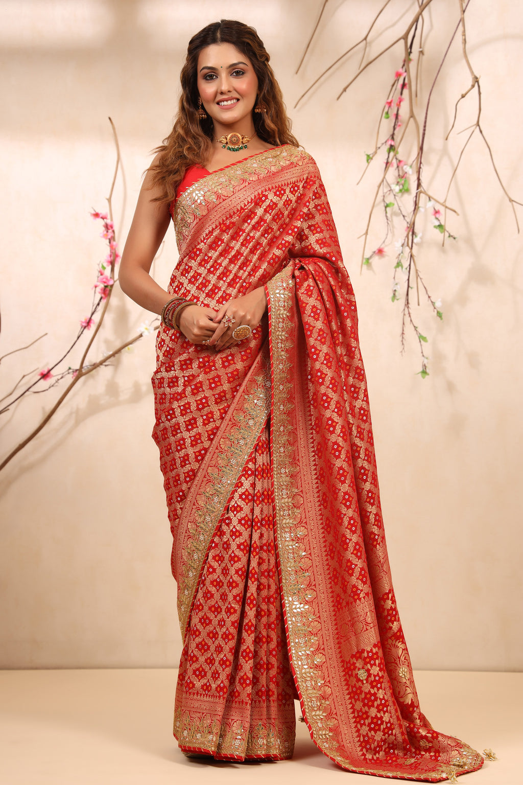 Buy beautiful red bandhej Banarasi saree online in USA with gota patti border. Make a fashion statement at weddings with stunning designer sarees, embroidered sarees with blouse, wedding sarees, handloom sarees from Pure Elegance Indian fashion store in USA.-full view