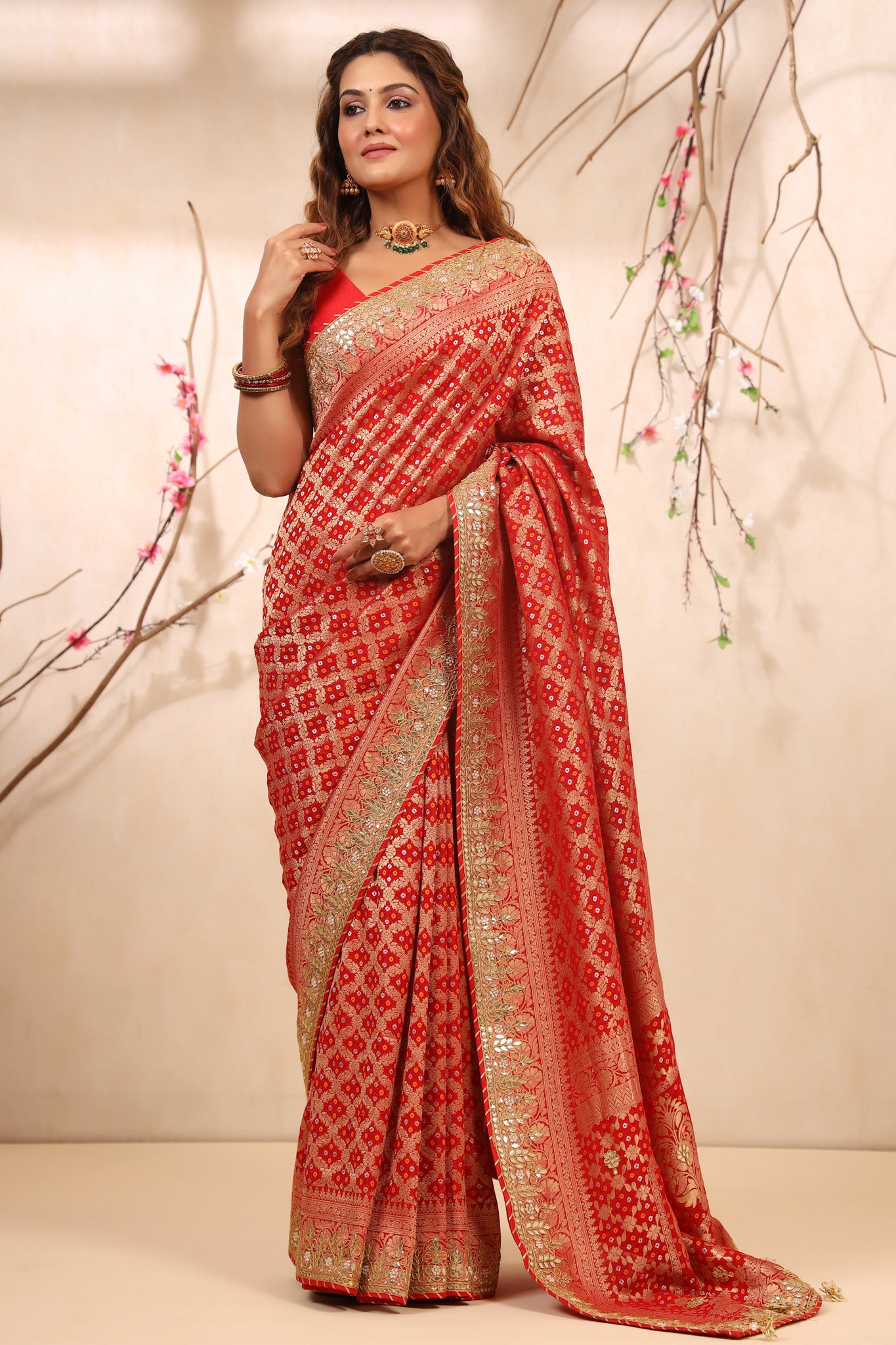 Buy beautiful red bandhej Banarasi saree online in USA with gota patti border. Make a fashion statement at weddings with stunning designer sarees, embroidered sarees with blouse, wedding sarees, handloom sarees from Pure Elegance Indian fashion store in USA.-front