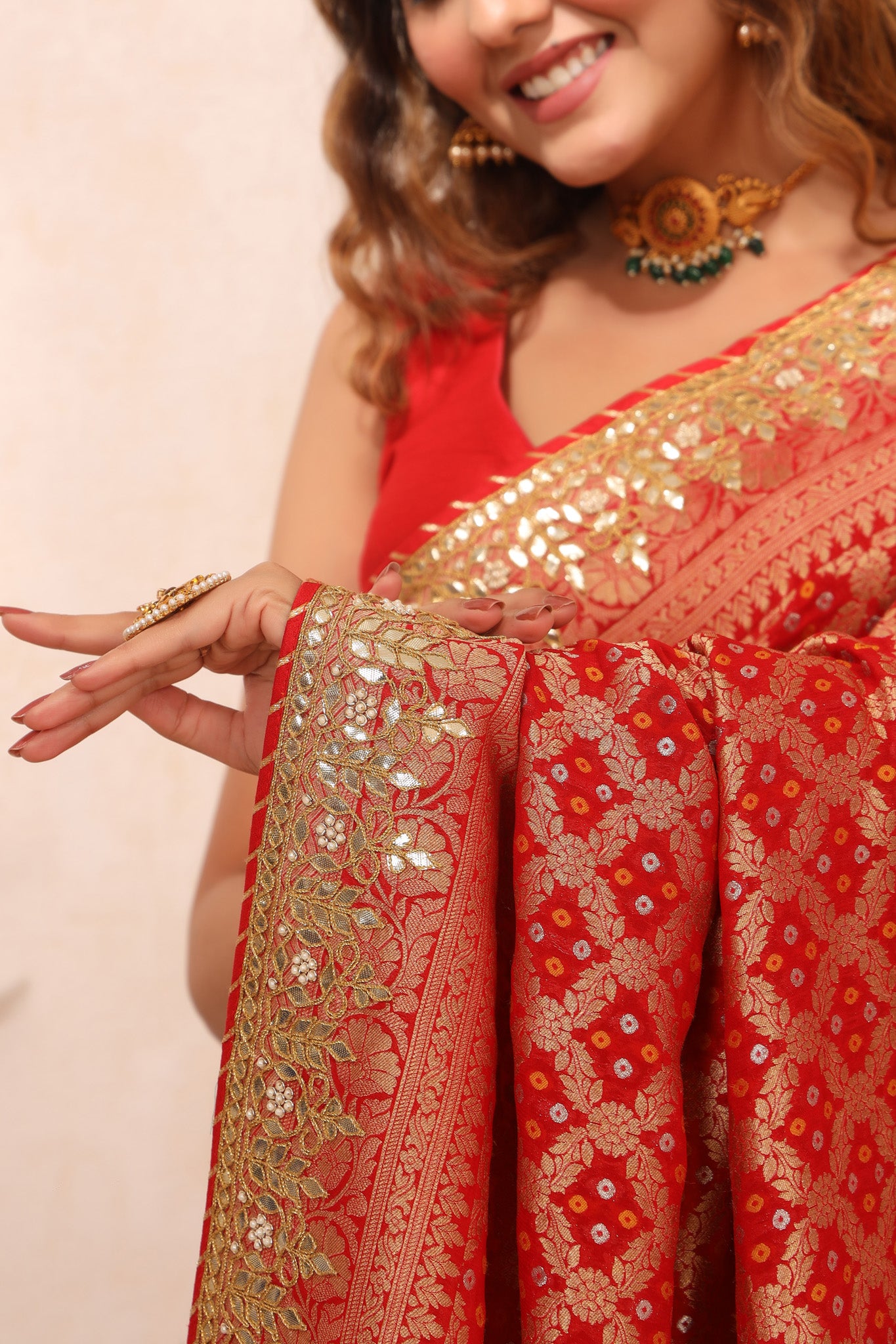 Buy beautiful red bandhej Banarasi saree online in USA with gota patti border. Make a fashion statement at weddings with stunning designer sarees, embroidered sarees with blouse, wedding sarees, handloom sarees from Pure Elegance Indian fashion store in USA.-details
