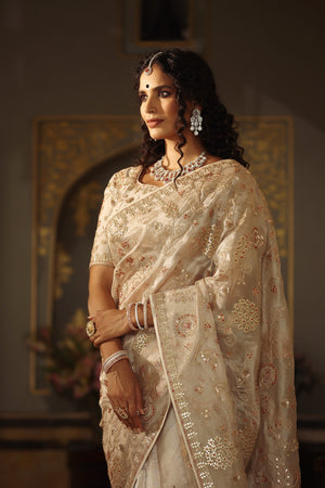 Buy cream embroidered organza silk saree online in USA with blouse. Make a fashion statement at weddings with stunning designer sarees, embroidered sarees with blouse, wedding sarees, handloom sarees from Pure Elegance Indian fashion store in USA.-closeup