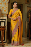 Buy yellow silk saree online in USA with heavy embroidery scalloped border. Make a fashion statement at weddings with stunning designer sarees, embroidered sarees with blouse, wedding sarees, handloom sarees from Pure Elegance Indian fashion store in USA.-full view