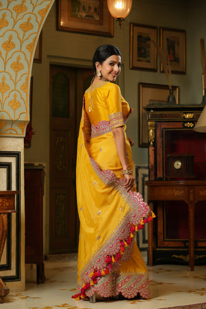 Buy yellow silk saree online in USA with heavy embroidery scalloped border. Make a fashion statement at weddings with stunning designer sarees, embroidered sarees with blouse, wedding sarees, handloom sarees from Pure Elegance Indian fashion store in USA.-back