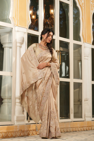 Shop beige tussar georgette saree online in USA with embroidered border. Make a fashion statement at weddings with stunning designer sarees, embroidered sarees with blouse, wedding sarees, handloom sarees from Pure Elegance Indian fashion store in USA.-side