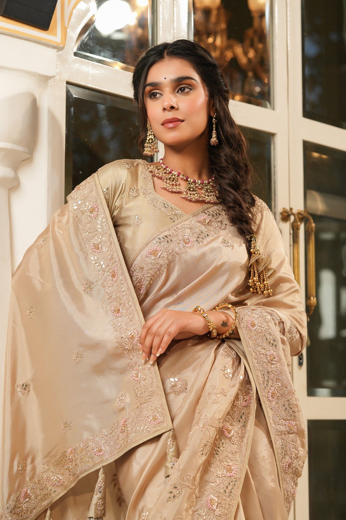 Shop beige tussar georgette saree online in USA with embroidered border. Make a fashion statement at weddings with stunning designer sarees, embroidered sarees with blouse, wedding sarees, handloom sarees from Pure Elegance Indian fashion store in USA.-closeup