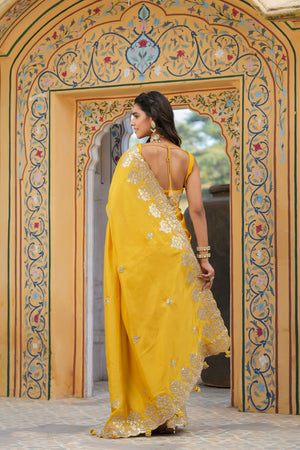 Buy yellow tussar georgette saree online in USA with embroidered border. Make a fashion statement at weddings with stunning designer sarees, embroidered sarees with blouse, wedding sarees, handloom sarees from Pure Elegance Indian fashion store in USA.-back