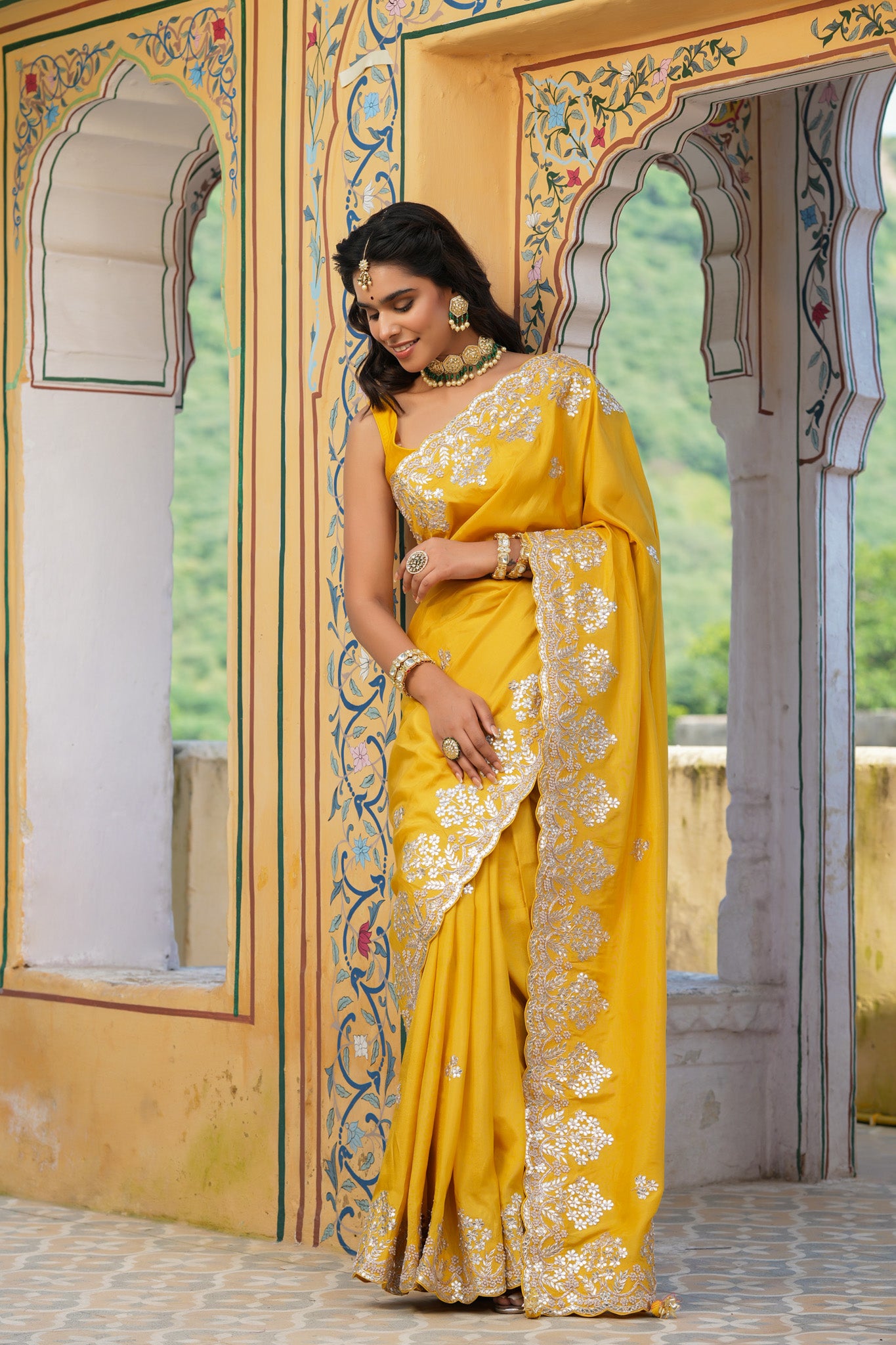 Buy yellow tussar georgette saree online in USA with embroidered border. Make a fashion statement at weddings with stunning designer sarees, embroidered sarees with blouse, wedding sarees, handloom sarees from Pure Elegance Indian fashion store in USA.-pleats