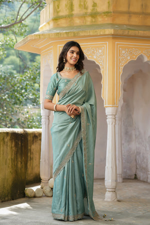 Shop sea green tussar georgette saree online in USA with embroidered blouse. Make a fashion statement at weddings with stunning designer sarees, embroidered sarees with blouse, wedding sarees, handloom sarees from Pure Elegance Indian fashion store in USA.-front