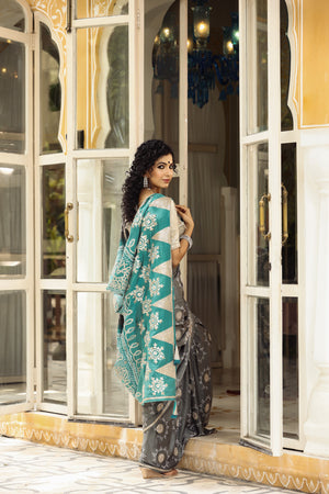 Shop beautiful grey tussar georgette saree online in USA with embroidered blouse. Make a fashion statement at weddings with stunning designer sarees, embroidered sarees with blouse, wedding sarees, handloom sarees from Pure Elegance Indian fashion store in USA.=-back