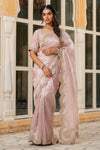 Shop powder pink tissue silk saree online in USA with scalloped border. Make a fashion statement at weddings with stunning designer sarees, embroidered sarees with blouse, wedding sarees, handloom sarees from Pure Elegance Indian fashion store in USA.-full view