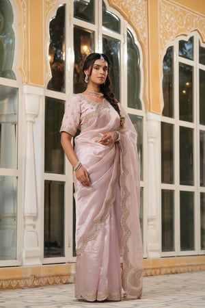 Shop powder pink tissue silk saree online in USA with scalloped border. Make a fashion statement at weddings with stunning designer sarees, embroidered sarees with blouse, wedding sarees, handloom sarees from Pure Elegance Indian fashion store in USA.-side