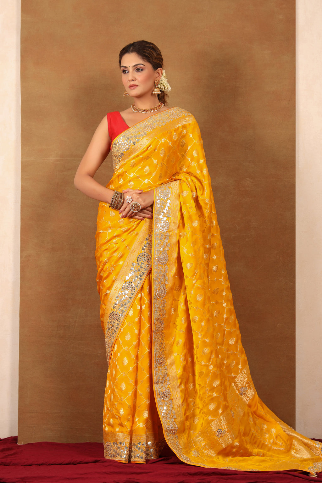 Buy yellow georgette Banarasi saree online in USA with embroidered border. Make a fashion statement at weddings with stunning designer sarees, embroidered sarees with blouse, wedding sarees, handloom sarees from Pure Elegance Indian fashion store in USA.-full view