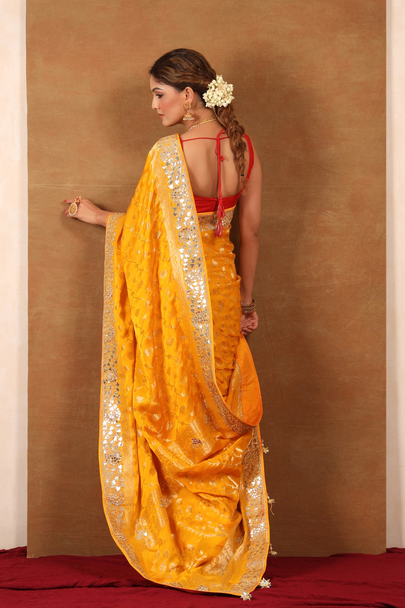 Buy yellow georgette Banarasi saree online in USA with embroidered border. Make a fashion statement at weddings with stunning designer sarees, embroidered sarees with blouse, wedding sarees, handloom sarees from Pure Elegance Indian fashion store in USA.-back