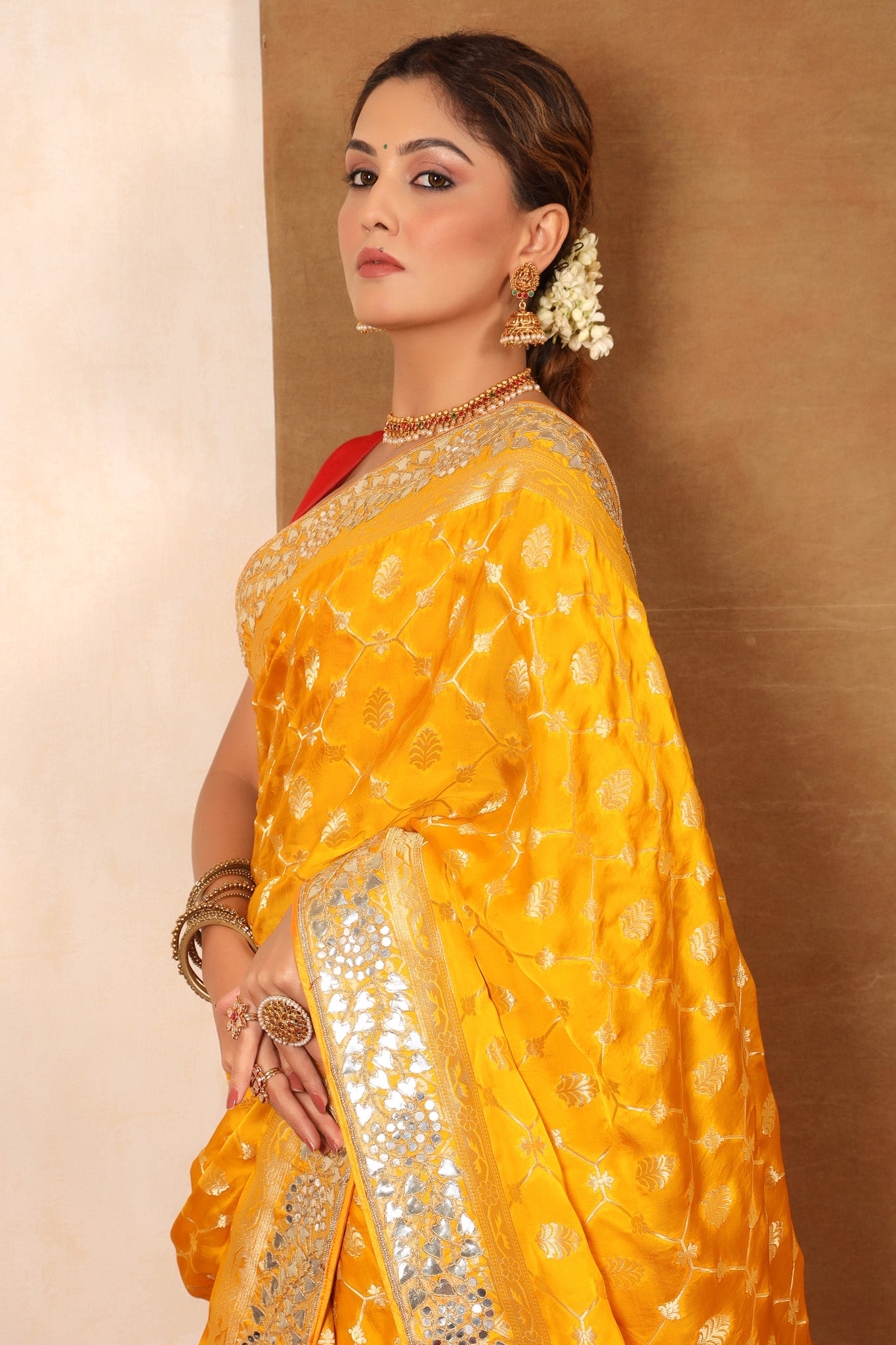 Buy yellow georgette Banarasi saree online in USA with embroidered border. Make a fashion statement at weddings with stunning designer sarees, embroidered sarees with blouse, wedding sarees, handloom sarees from Pure Elegance Indian fashion store in USA.-closeup