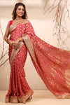 Shop blush pink georgette Banarasi saree online in USA with embroidered border. Make a fashion statement at weddings with stunning designer sarees, embroidered sarees with blouse, wedding sarees, handloom sarees from Pure Elegance Indian fashion store in USA.-full view