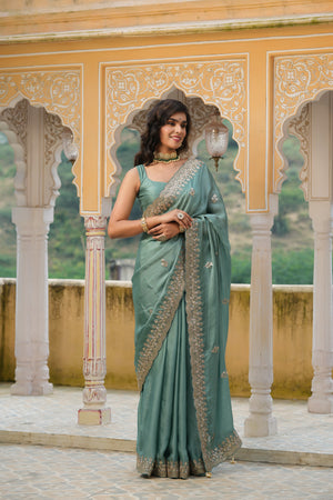 Shop sea green tussar georgette saree online in USA with embroidered border. Make a fashion statement at weddings with stunning designer sarees, embroidered sarees with blouse, wedding sarees, handloom sarees from Pure Elegance Indian fashion store in USA.-front