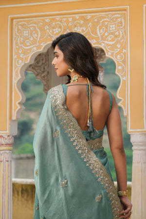 Shop sea green tussar georgette saree online in USA with embroidered border. Make a fashion statement at weddings with stunning designer sarees, embroidered sarees with blouse, wedding sarees, handloom sarees from Pure Elegance Indian fashion store in USA.-back