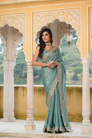Shop sea green tussar georgette saree online in USA with embroidered border. Make a fashion statement at weddings with stunning designer sarees, embroidered sarees with blouse, wedding sarees, handloom sarees from Pure Elegance Indian fashion store in USA.-saree