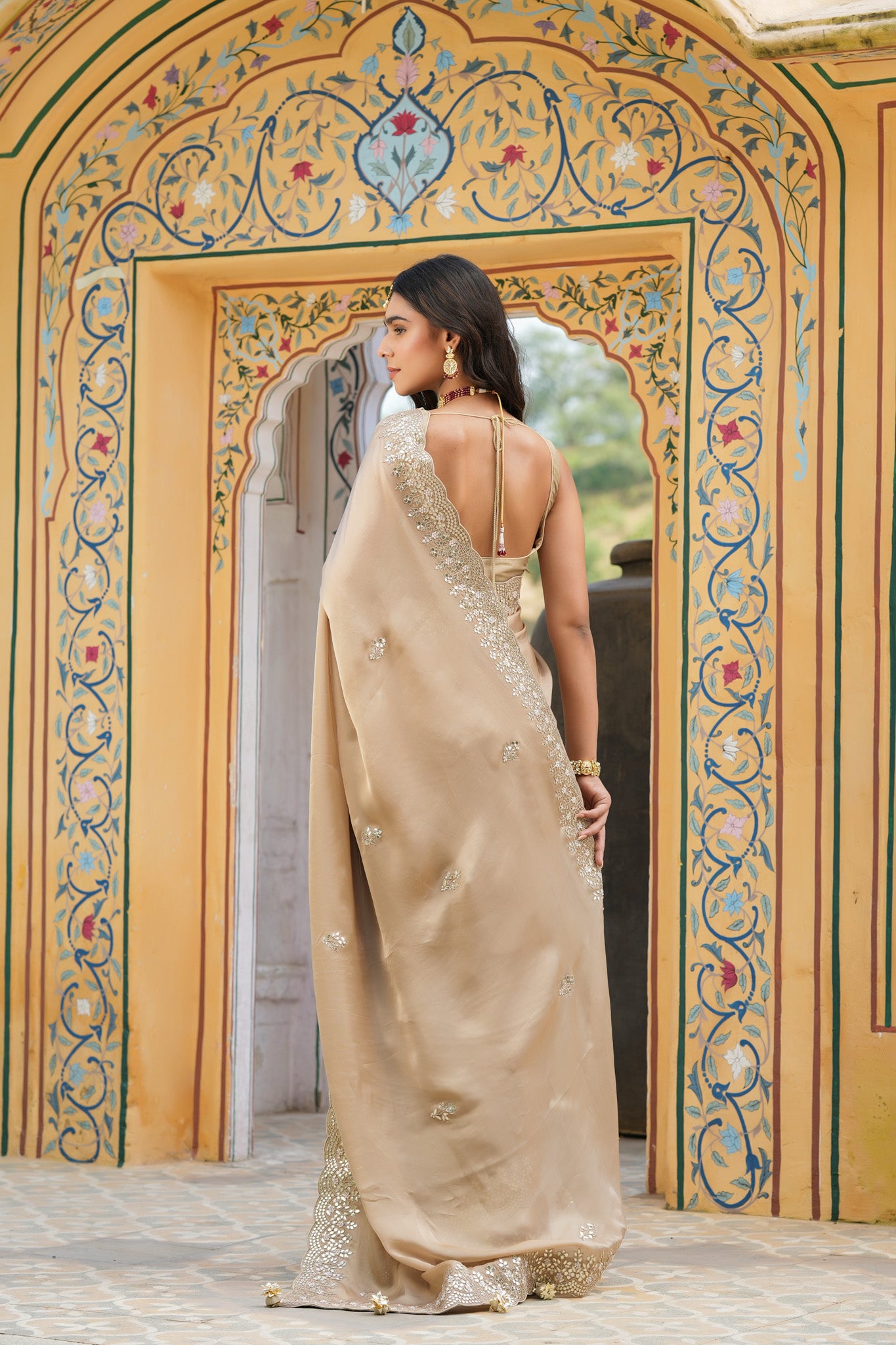 Buy beige tussar georgette saree online in USA with embroidered border. Make a fashion statement at weddings with stunning designer sarees, embroidered sarees with blouse, wedding sarees, handloom sarees from Pure Elegance Indian fashion store in USA.-back