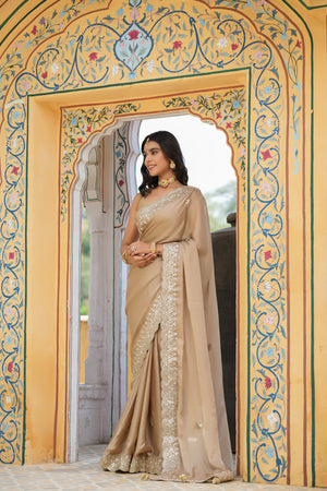 Buy beige tussar georgette saree online in USA with embroidered border. Make a fashion statement at weddings with stunning designer sarees, embroidered sarees with blouse, wedding sarees, handloom sarees from Pure Elegance Indian fashion store in USA.-side