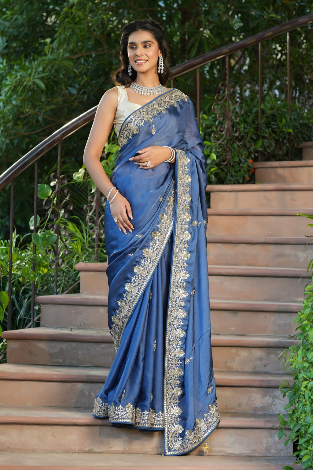 Shop blue tussar georgette saree online in USA with embroidered border. Make a fashion statement at weddings with stunning designer sarees, embroidered sarees with blouse, wedding sarees, handloom sarees from Pure Elegance Indian fashion store in USA.-full view