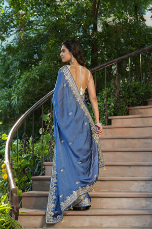 Shop blue tussar georgette saree online in USA with embroidered border. Make a fashion statement at weddings with stunning designer sarees, embroidered sarees with blouse, wedding sarees, handloom sarees from Pure Elegance Indian fashion store in USA.-back