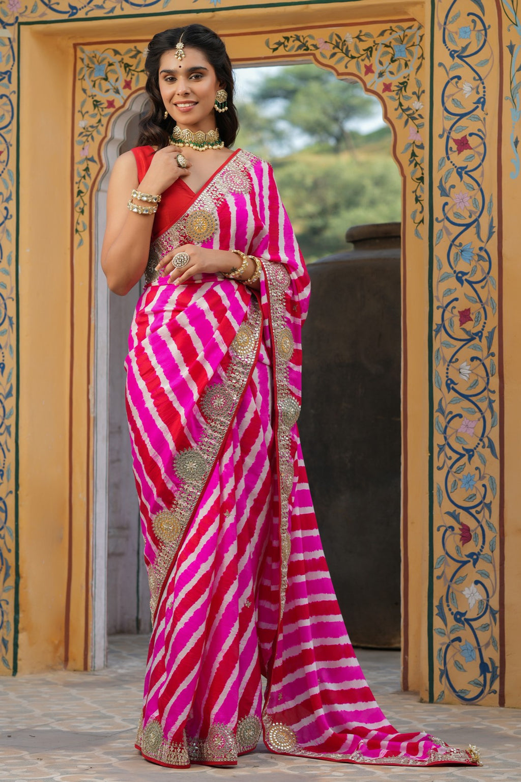 Shop beautiful pink and red stripes embroidered tussar georgette saree online in USA with saree blouse. Make a fashion statement at weddings with stunning designer sarees, embroidered sarees with blouse, wedding sarees, handloom sarees from Pure Elegance Indian fashion store in USA.-full view