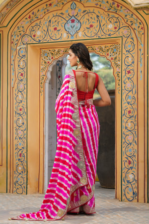 Shop beautiful pink and red stripes embroidered tussar georgette saree online in USA with saree blouse. Make a fashion statement at weddings with stunning designer sarees, embroidered sarees with blouse, wedding sarees, handloom sarees from Pure Elegance Indian fashion store in USA.-back