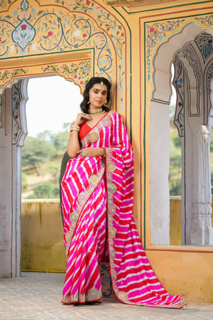 Shop beautiful pink and red stripes embroidered tussar georgette saree online in USA with saree blouse. Make a fashion statement at weddings with stunning designer sarees, embroidered sarees with blouse, wedding sarees, handloom sarees from Pure Elegance Indian fashion store in USA.-front