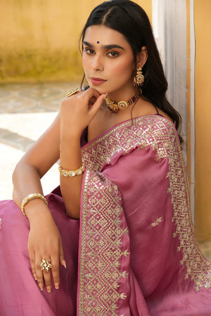 Buy onion pink embroidered tussar georgette saree online in USA with blouse. Make a fashion statement at weddings with stunning designer sarees, embroidered sarees with blouse, wedding sarees, handloom sarees from Pure Elegance Indian fashion store in USA.-closeup