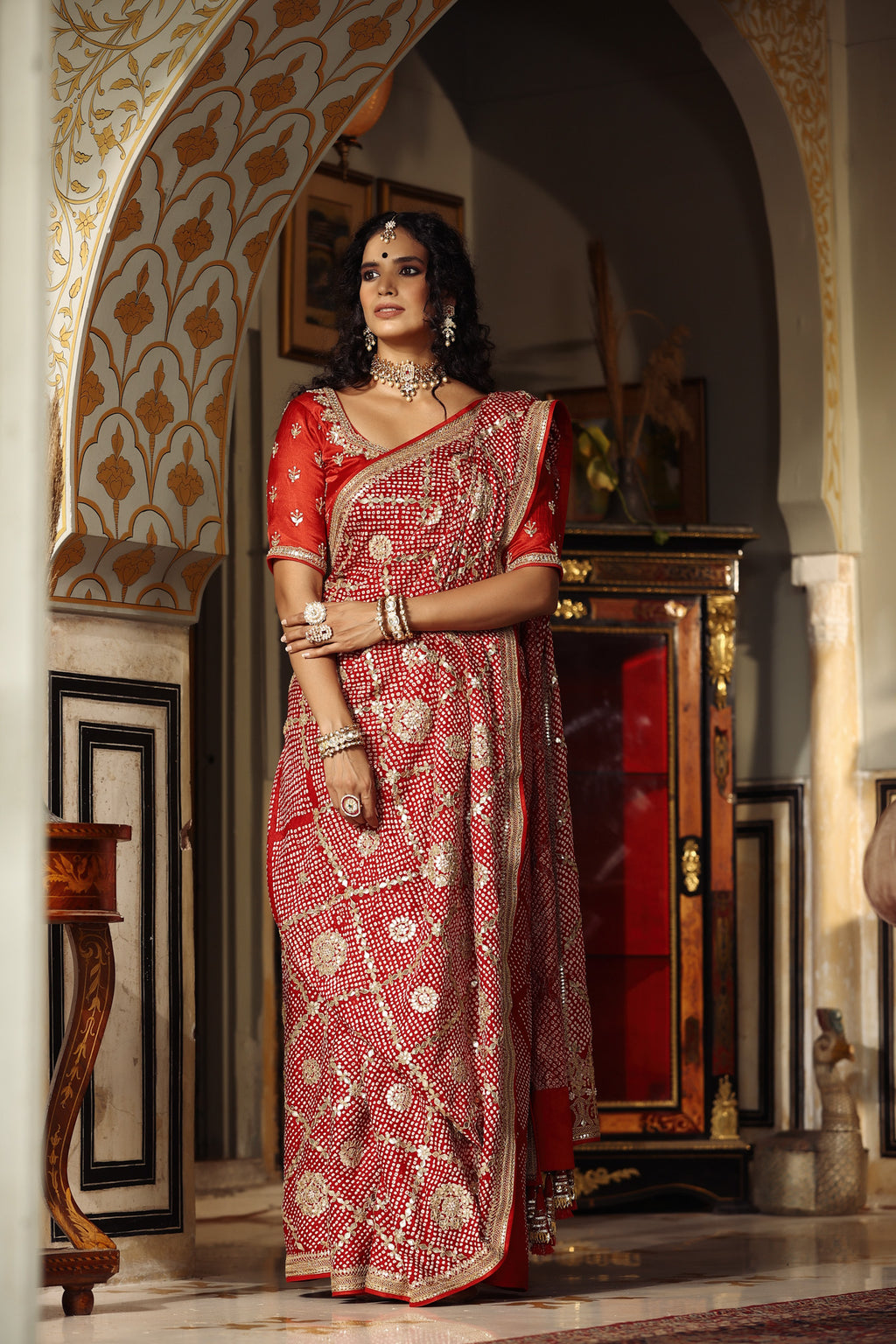 Shop red embroidered bandhej Banarasi saree online in USA with blouse. Make a fashion statement at weddings with stunning designer sarees, embroidered sarees with blouse, wedding sarees, handloom sarees from Pure Elegance Indian fashion store in USA.-full view