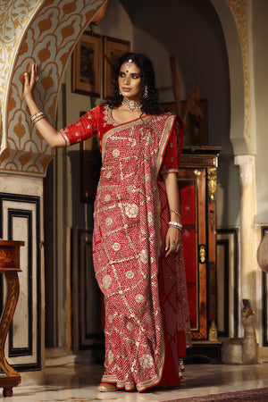 Shop red embroidered bandhej Banarasi saree online in USA with blouse. Make a fashion statement at weddings with stunning designer sarees, embroidered sarees with blouse, wedding sarees, handloom sarees from Pure Elegance Indian fashion store in USA.-front