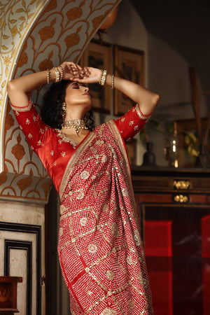 Shop red embroidered bandhej Banarasi saree online in USA with blouse. Make a fashion statement at weddings with stunning designer sarees, embroidered sarees with blouse, wedding sarees, handloom sarees from Pure Elegance Indian fashion store in USA.-closeup