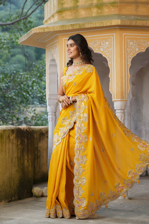 Buy beautiful yellow tussar georgette saree online in USA with hand embroidered border. Make a fashion statement at weddings with stunning designer sarees, embroidered sarees with blouse, wedding sarees, handloom sarees from Pure Elegance Indian fashion store in USA.-pallu