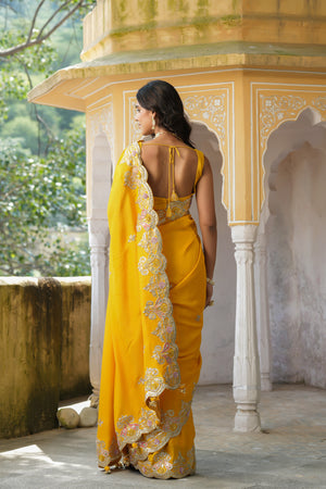 Buy beautiful yellow tussar georgette saree online in USA with hand embroidered border. Make a fashion statement at weddings with stunning designer sarees, embroidered sarees with blouse, wedding sarees, handloom sarees from Pure Elegance Indian fashion store in USA.-back