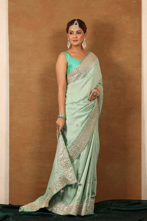 Buy mint green tussar georgette saree online in USA with gota work border. Make a fashion statement at weddings with stunning designer sarees, embroidered sarees with blouse, wedding sarees, handloom sarees from Pure Elegance Indian fashion store in USA.-side