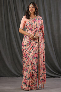 Shop light pink floral crepe saree online in USA with scalloped border. Make a fashion statement at weddings with stunning designer sarees, embroidered sarees with blouse, wedding sarees, handloom sarees from Pure Elegance Indian fashion store in USA.-full view