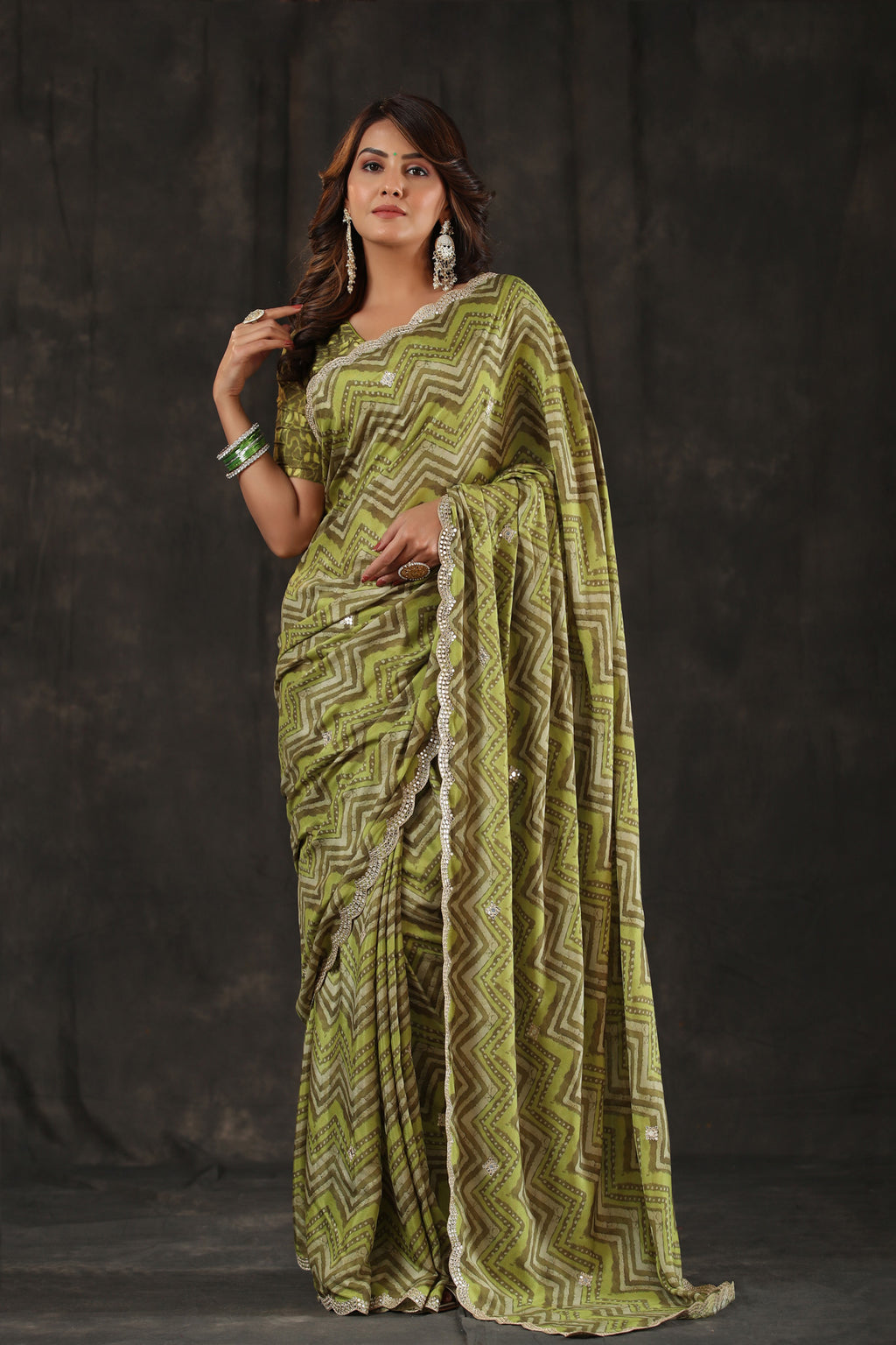 Shop pista green chevron print crepe saree online in USA with scalloped border. Make a fashion statement at weddings with stunning designer sarees, embroidered sarees with blouse, wedding sarees, handloom sarees from Pure Elegance Indian fashion store in USA.-full view
