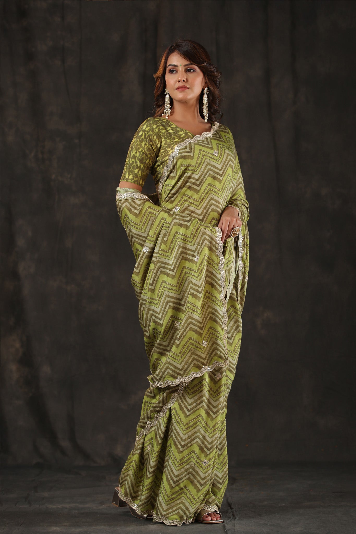 Shop pista green chevron print crepe saree online in USA with scalloped border. Make a fashion statement at weddings with stunning designer sarees, embroidered sarees with blouse, wedding sarees, handloom sarees from Pure Elegance Indian fashion store in USA.-side