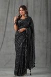 Buy black printed crepe saree online in USA with scalloped border. Make a fashion statement at weddings with stunning designer sarees, embroidered sarees with blouse, wedding sarees, handloom sarees from Pure Elegance Indian fashion store in USA.-full view
