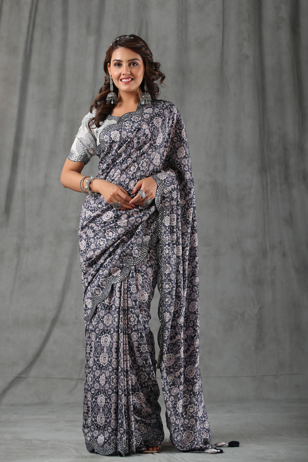 Buy dark grey floral print crepe saree online in USA with scalloped border. Make a fashion statement at weddings with stunning designer sarees, embroidered sarees with blouse, wedding sarees, handloom sarees from Pure Elegance Indian fashion store in USA.-full view