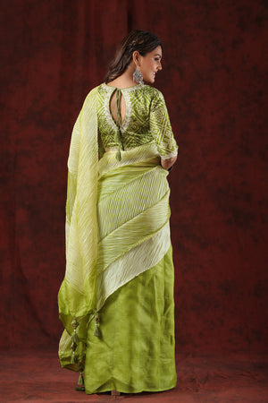 Shop pista green striped tussar silk saree online in USA with bandhej blouse. Make a fashion statement at weddings with stunning designer sarees, embroidered sarees with blouse, wedding sarees, handloom sarees from Pure Elegance Indian fashion store in USA.-back