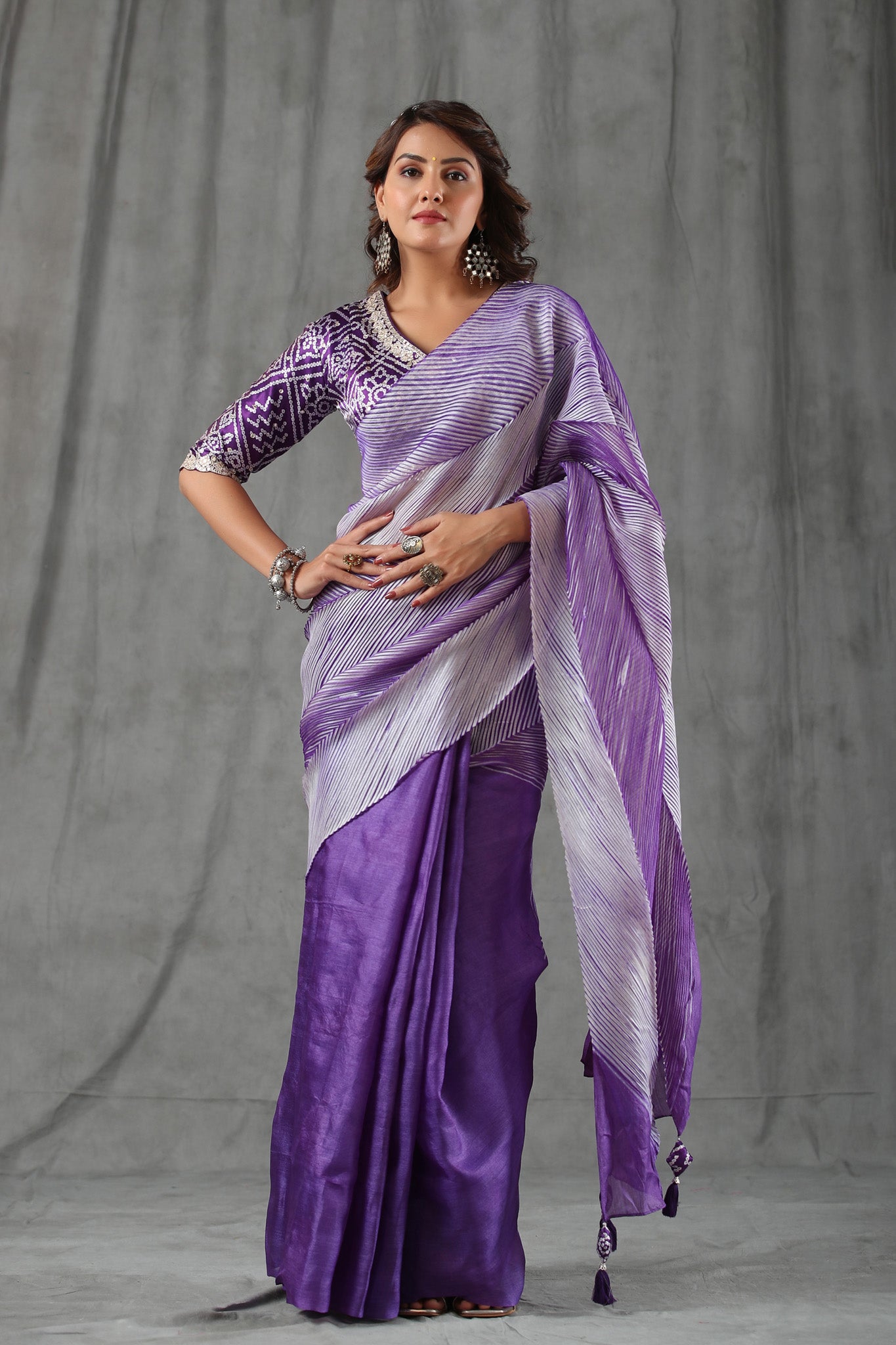 Buy lavender striped tussar silk saree online in USA with bandhej blouse. Make a fashion statement at weddings with stunning designer sarees, embroidered sarees with blouse, wedding sarees, handloom sarees from Pure Elegance Indian fashion store in USA.-full view