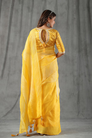 Buy yellow stripes tussar silk saree online in USA with bandhej blouse. Make a fashion statement at weddings with stunning designer sarees, embroidered sarees with blouse, wedding sarees, handloom sarees from Pure Elegance Indian fashion store in USA.-back