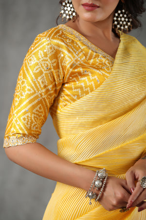 Buy yellow stripes tussar silk saree online in USA with bandhej blouse. Make a fashion statement at weddings with stunning designer sarees, embroidered sarees with blouse, wedding sarees, handloom sarees from Pure Elegance Indian fashion store in USA.-details