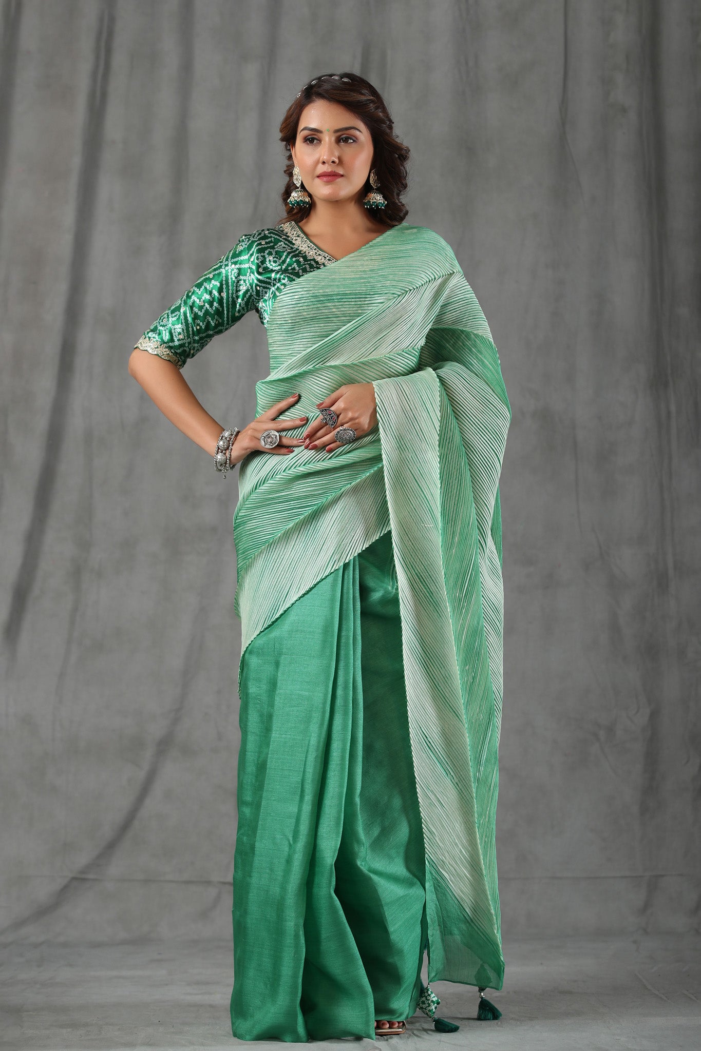 Shop pastel green stripes tussar silk saree online in USA with bandhej saree blouse. Make a fashion statement at weddings with stunning designer sarees, embroidered sarees with blouse, wedding sarees, handloom sarees from Pure Elegance Indian fashion store in USA.-full view