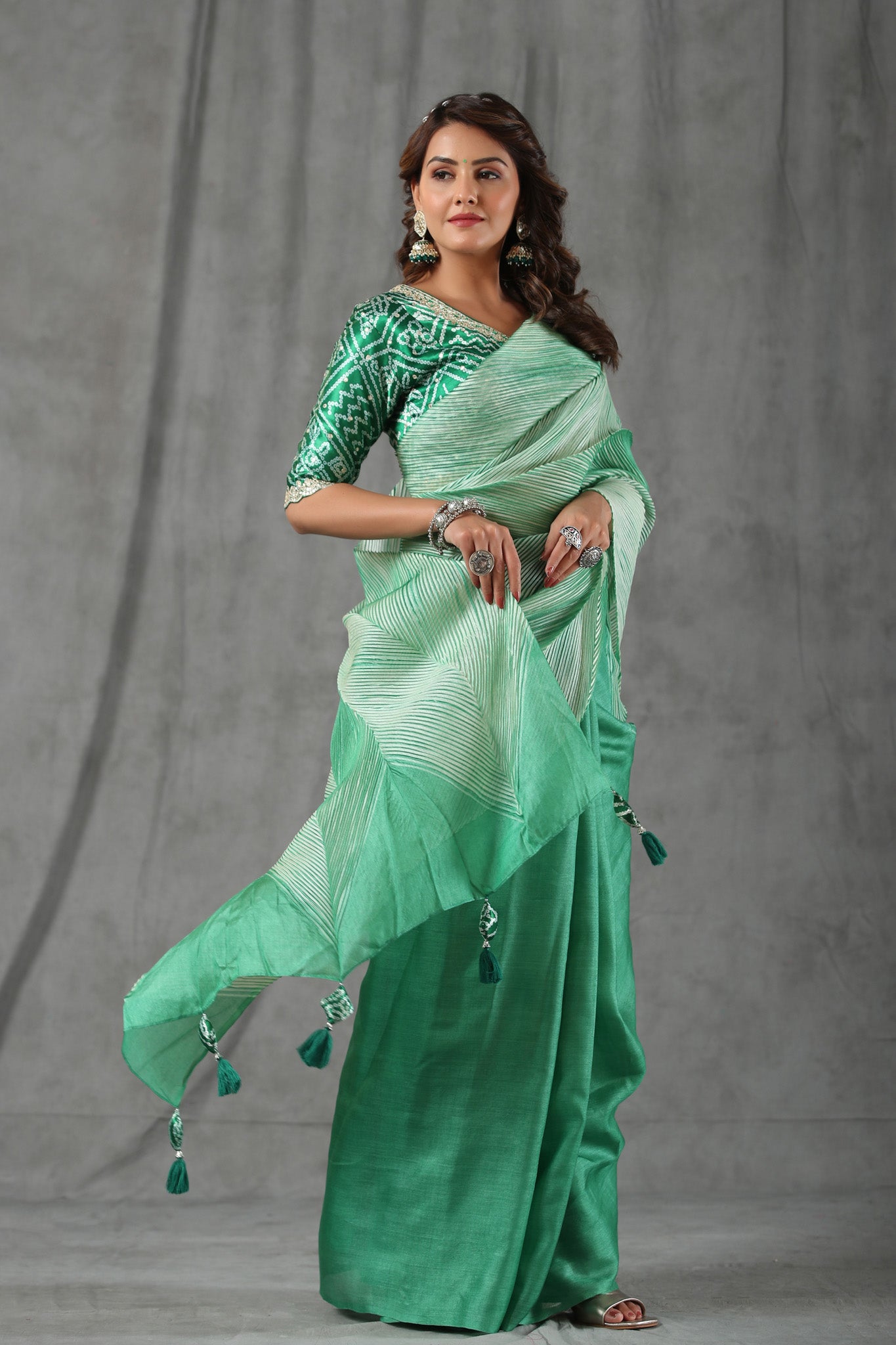 Shop pastel green stripes tussar silk saree online in USA with bandhej saree blouse. Make a fashion statement at weddings with stunning designer sarees, embroidered sarees with blouse, wedding sarees, handloom sarees from Pure Elegance Indian fashion store in USA.-side